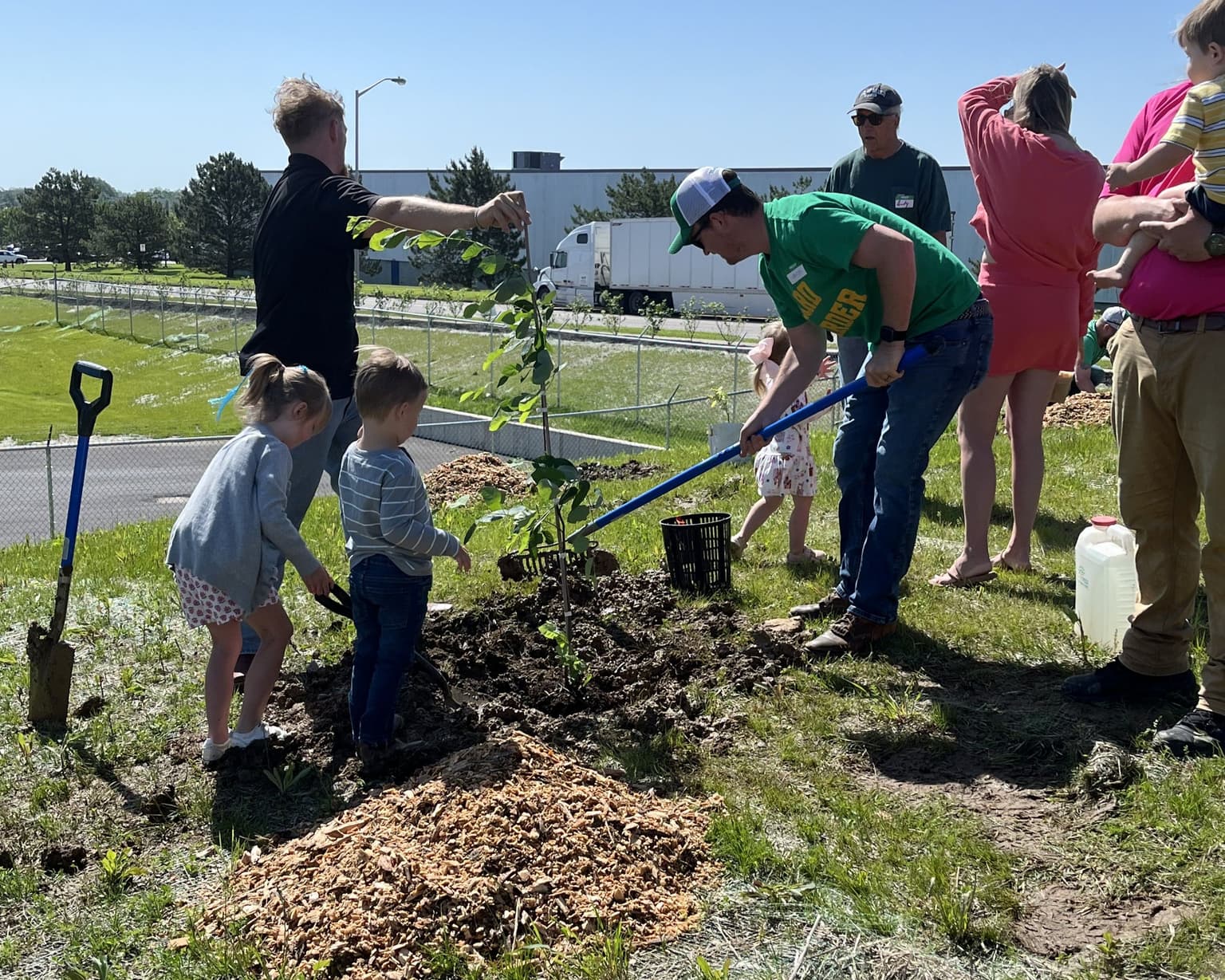 Weed Man Lexington Plants 50 Trees outside Local Food Pantry